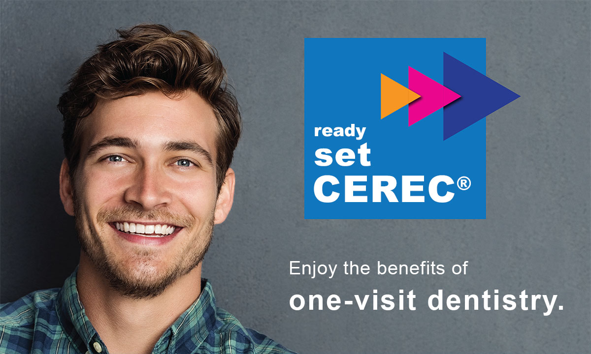 The image shows a smiling man with blue eyes, wearing a plaid shirt, standing against a gray background. He appears to be in his late twenties to early thirties. In the foreground, there s a graphic with text that reads  READY SET CEREC,  followed by  SET DENTAL PRACTICE  and a logo that includes a blue triangle with a white letter  C . Below the logo is a slogan stating  ENJOY THE BENEFITS OF ONE-VISIT DENTISTRY.  The style of the image suggests it s an advertisement or promotional material for dental technology.
